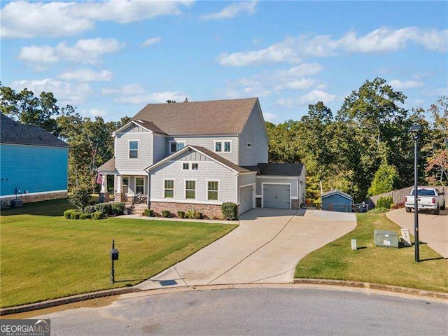 view of front of house with a garage and a front lawn