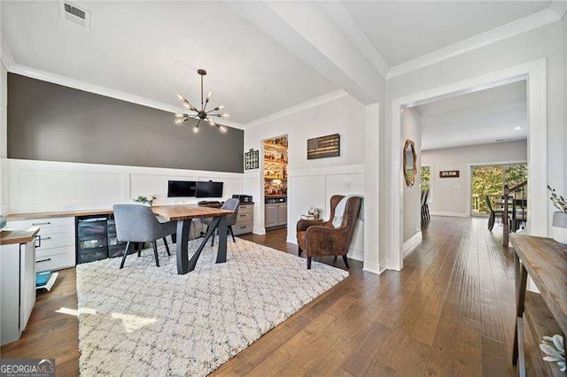 home office with crown molding, dark hardwood / wood-style floors, and a notable chandelier