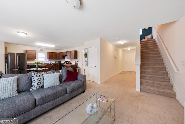 living room featuring light carpet