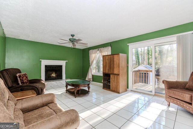 tiled living room with ceiling fan