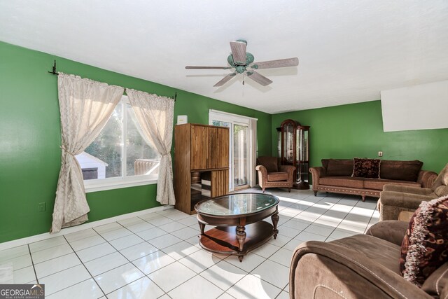 tiled living room featuring ceiling fan