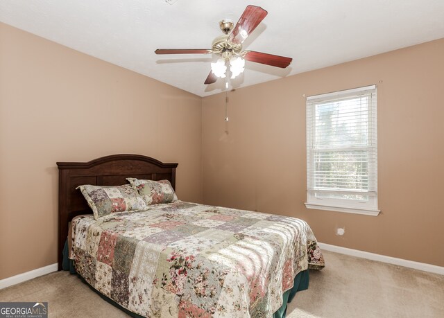 carpeted bedroom featuring ceiling fan