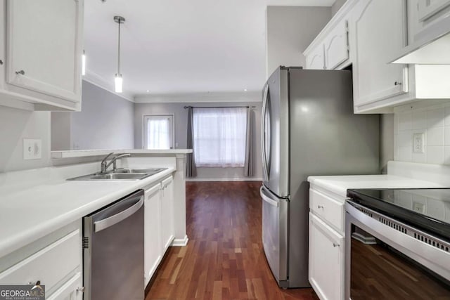 kitchen with sink, dishwasher, hanging light fixtures, white cabinets, and range