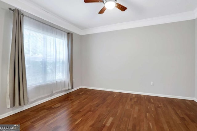 empty room with hardwood / wood-style floors, ceiling fan, and ornamental molding