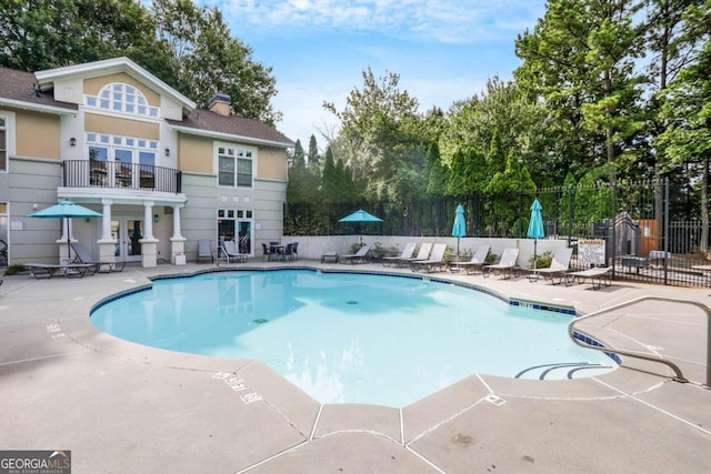 view of pool featuring a patio