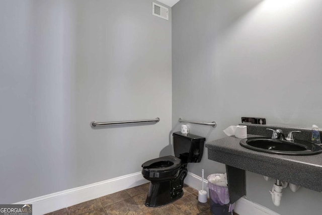 bathroom with sink and toilet