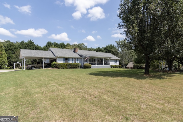 ranch-style home with a front lawn and a carport