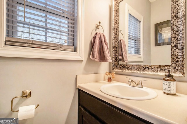 bathroom with a healthy amount of sunlight and vanity