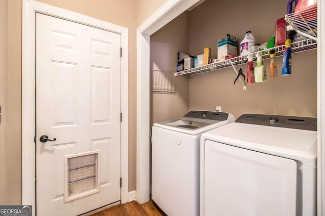 laundry room with independent washer and dryer and hardwood / wood-style floors