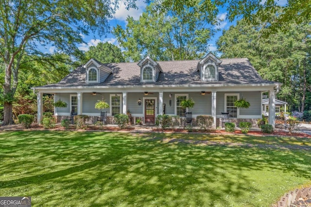 new england style home with a porch and a front yard