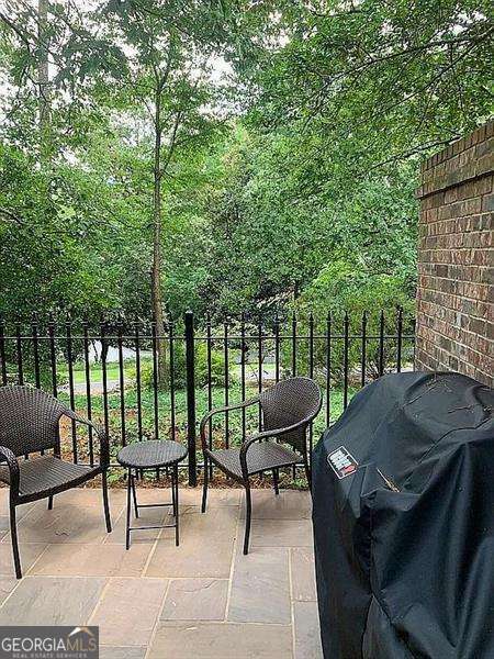 balcony with a patio and grilling area