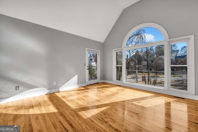 interior space featuring light hardwood / wood-style flooring and lofted ceiling