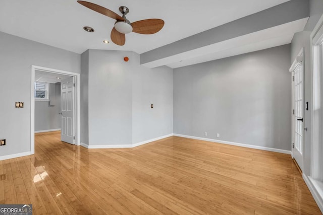 unfurnished room featuring ceiling fan and light wood-type flooring