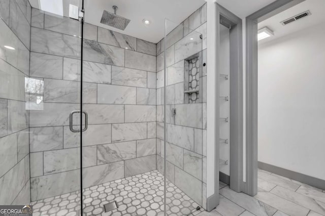 bathroom featuring an enclosed shower