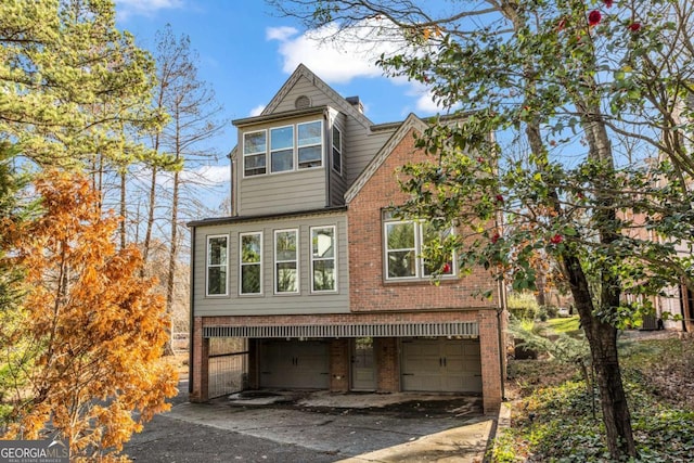 view of side of home featuring a garage