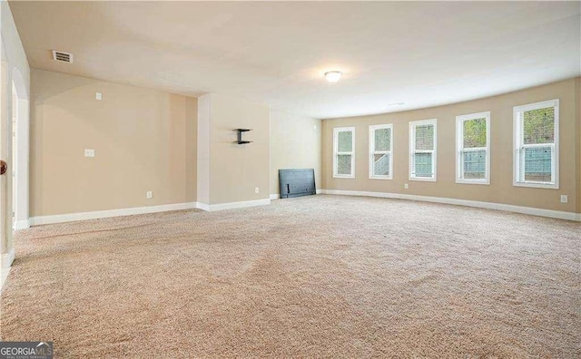 unfurnished living room with carpet floors