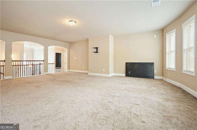 unfurnished living room with carpet