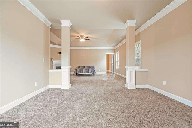 unfurnished living room featuring ceiling fan, carpet floors, and ornamental molding