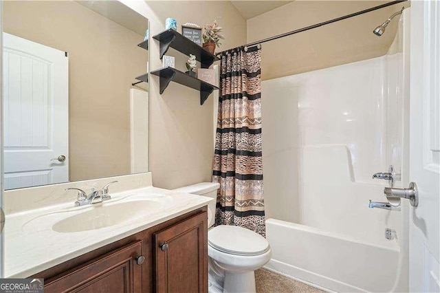 full bathroom featuring shower / bath combo, vanity, and toilet