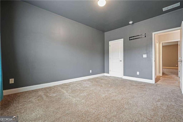 unfurnished bedroom with light carpet