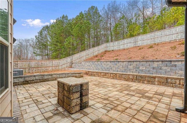 view of patio with central AC