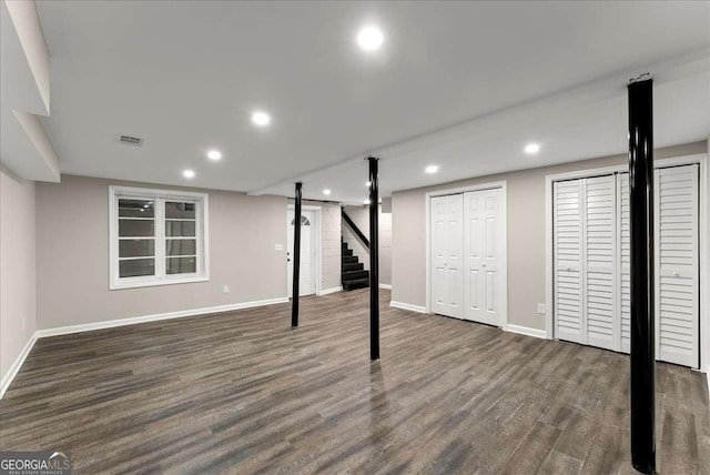 basement with dark wood-type flooring