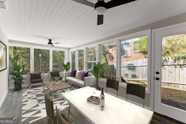 sunroom / solarium with wood ceiling and ceiling fan