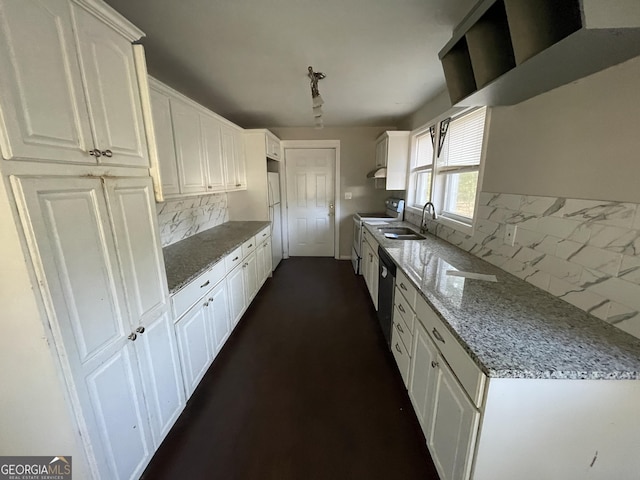 kitchen featuring white cabinetry, sink, light stone countertops, electric range oven, and tasteful backsplash