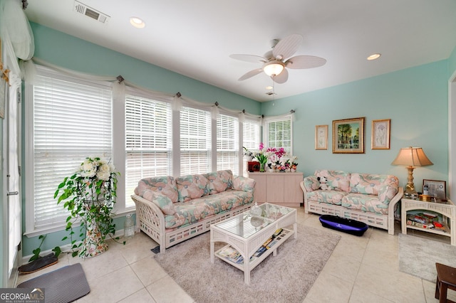 tiled living room featuring ceiling fan