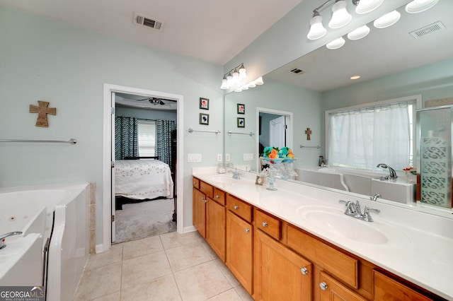 bathroom with vanity, ceiling fan, tile patterned flooring, and a bathtub