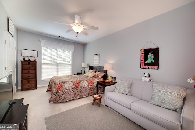 carpeted bedroom with ceiling fan