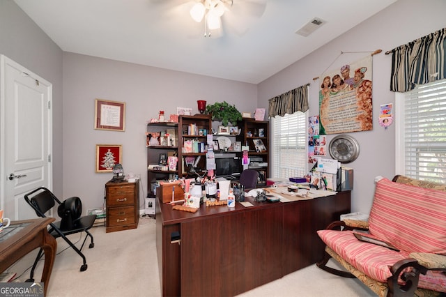 carpeted office with ceiling fan