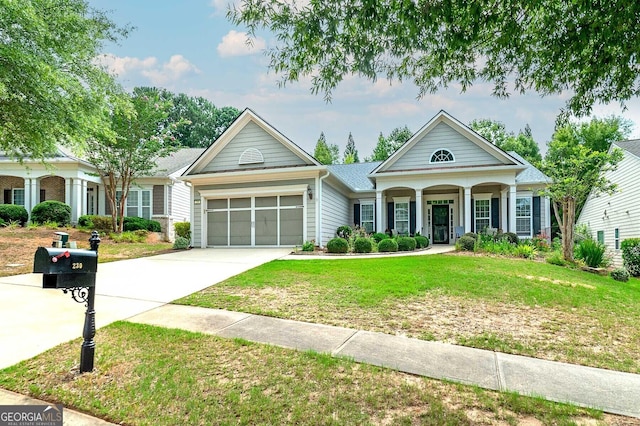 view of front facade with a front lawn, a porch, and a garage