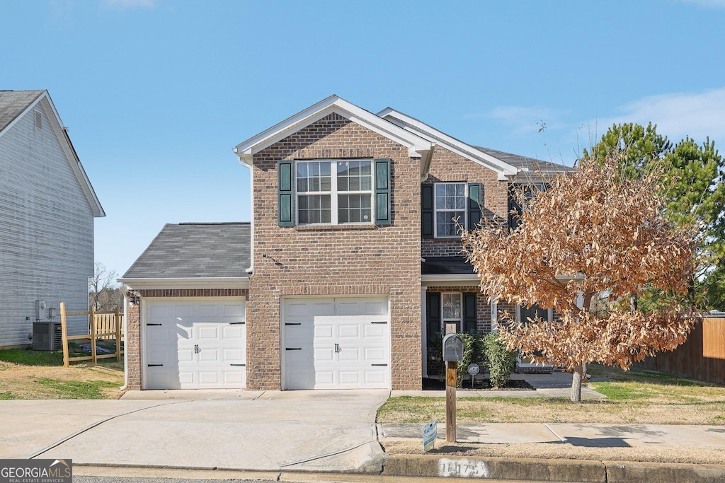 front facade with cooling unit and a garage