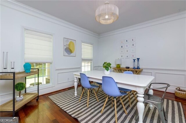 dining room featuring dark hardwood / wood-style floors and ornamental molding