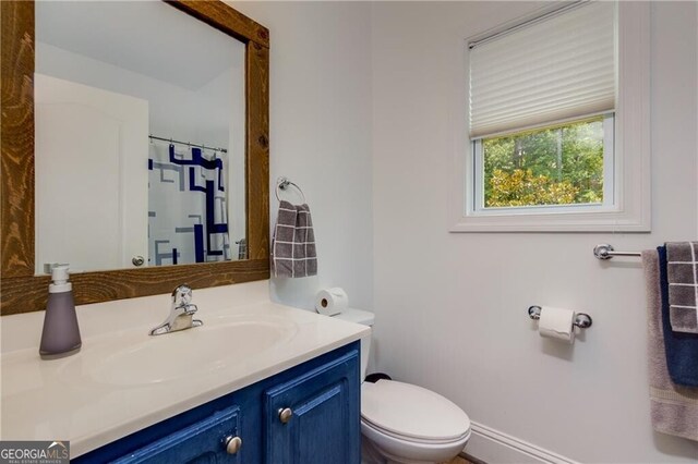 bathroom with vanity and toilet