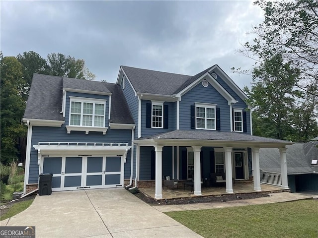 view of front of home with a porch and a garage