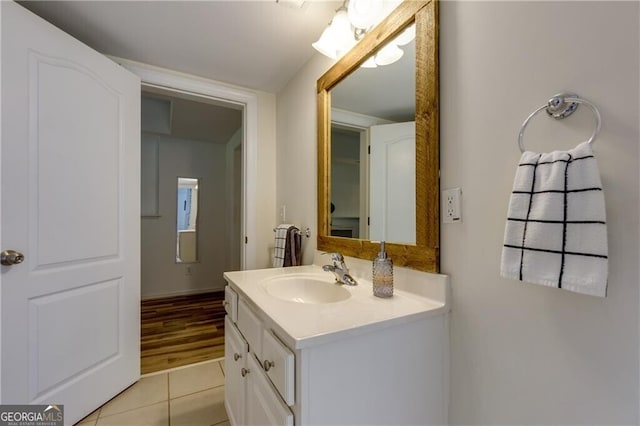 bathroom featuring tile patterned flooring and vanity