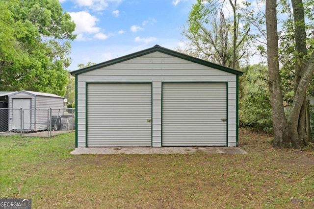 garage with a lawn