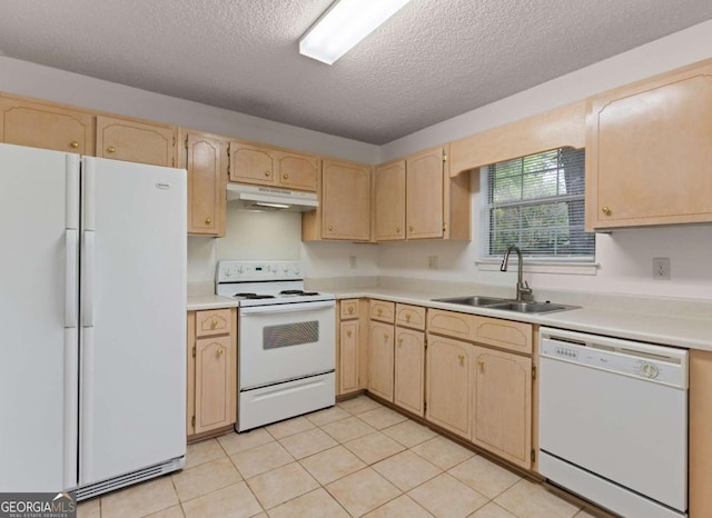 kitchen featuring sink, a textured ceiling, white appliances, light brown cabinetry, and light tile patterned flooring