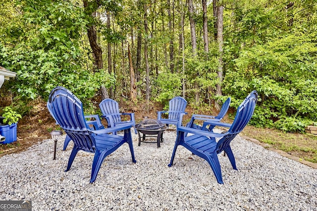 view of patio / terrace with an outdoor fire pit