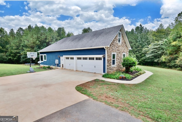 view of home's exterior featuring a garage and a lawn