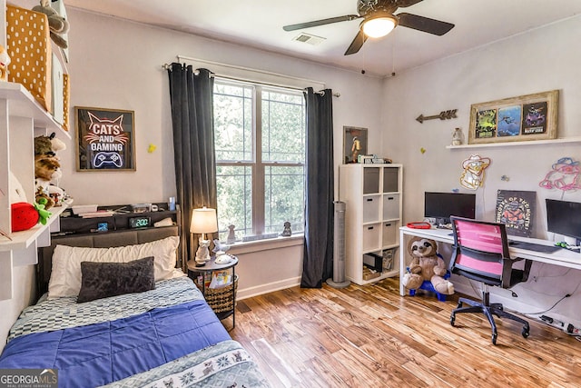 bedroom featuring hardwood / wood-style floors and ceiling fan