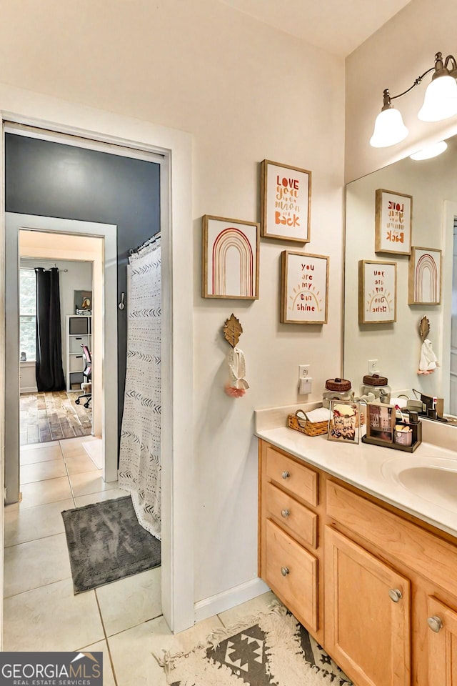 bathroom with vanity and tile patterned flooring