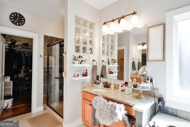 bathroom with tile patterned floors, vanity, and plus walk in shower