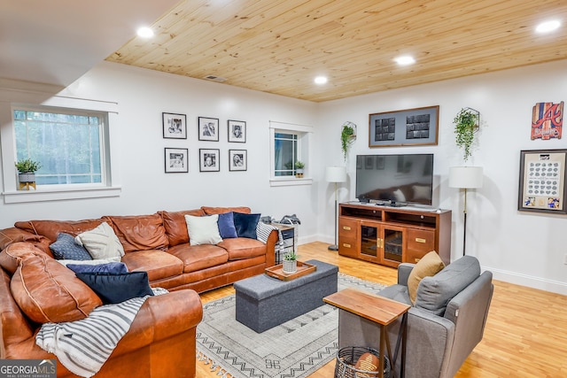 living room with wood ceiling and light hardwood / wood-style flooring