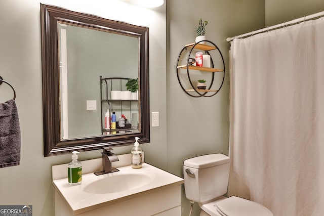 bathroom featuring vanity and toilet