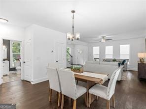 dining area featuring dark hardwood / wood-style floors and ceiling fan