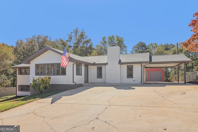 ranch-style house featuring a carport