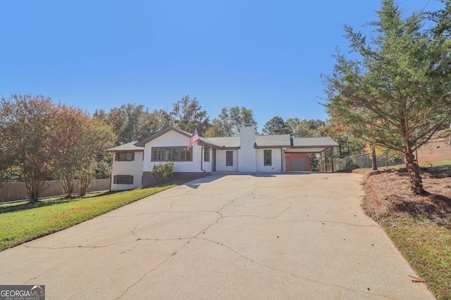 ranch-style house with a front lawn and a garage